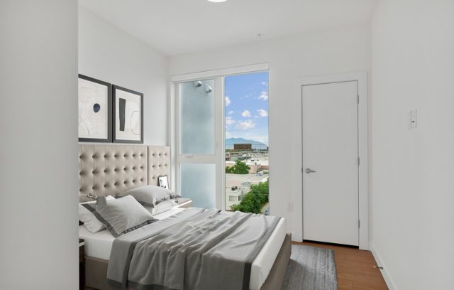 Model bedroom with an abundance of natural lighting