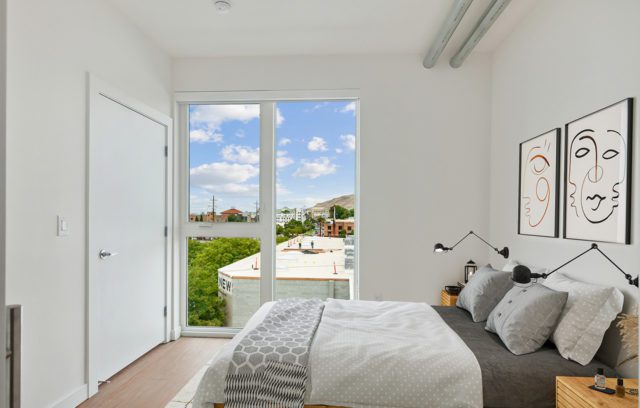 Model bedroom with large windows
