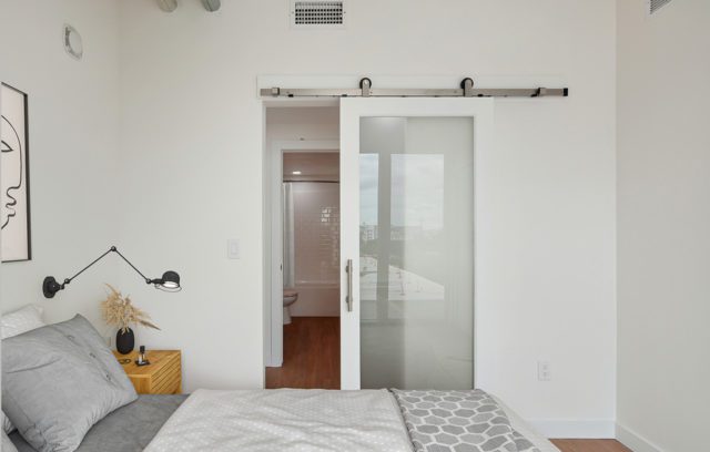 Model bedroom with barn-style sliding door