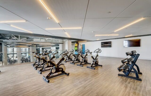 Fitness center with stationary bikes and weights